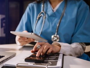 Healthcare Costs And Fees Concept.hand Of Smart Doctor Used A Ca