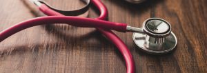 Stethoscope On Table With Notebook